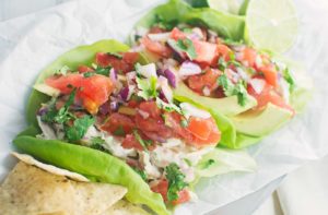 Mexican Chicken Salad with homemade Pico de Gallo served over lettuce.