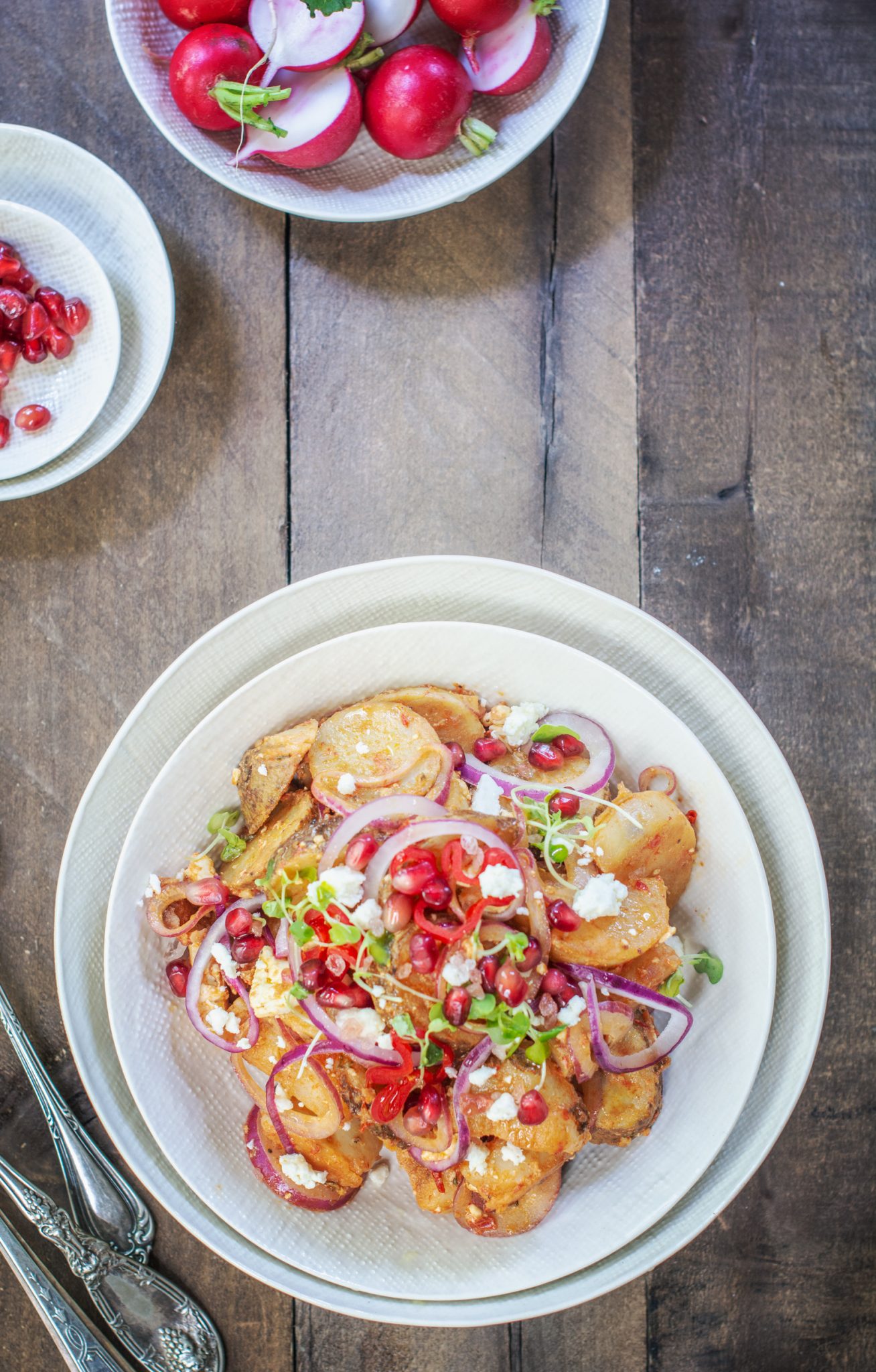 Overhead of Moroccan potato salad on wooden table