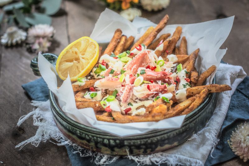 Blu bowl of loaded crab legs