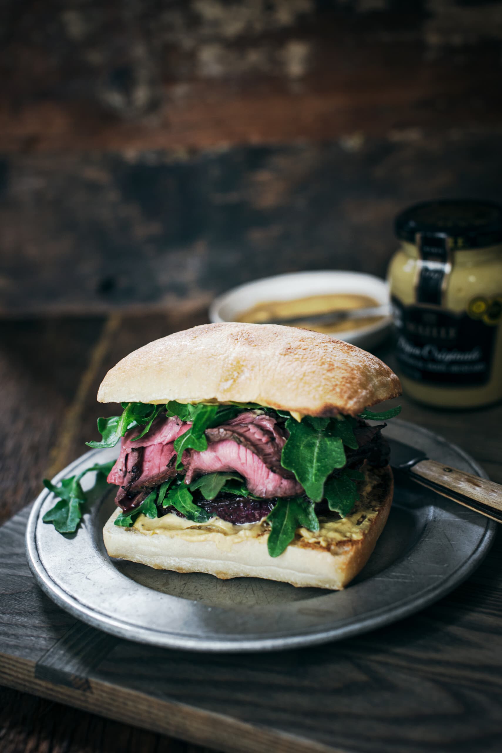 Ciabatta steak and onion sandwich with Maille dijon mustard